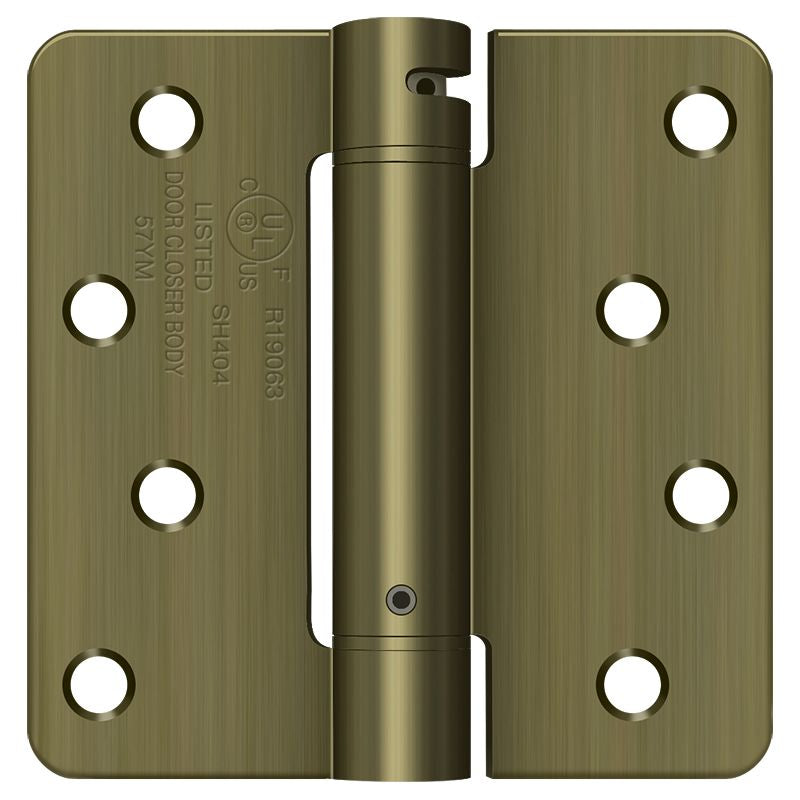 Deltana DSH4R45 4" x 4" x 1/4" Spring Hinge; Antique Brass Finish Main image